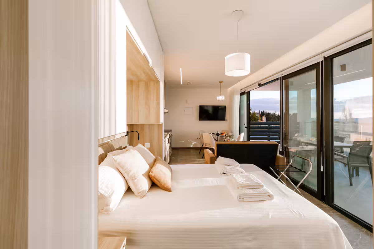 Bedroom with a double bed and sliding glass doors to the terrace