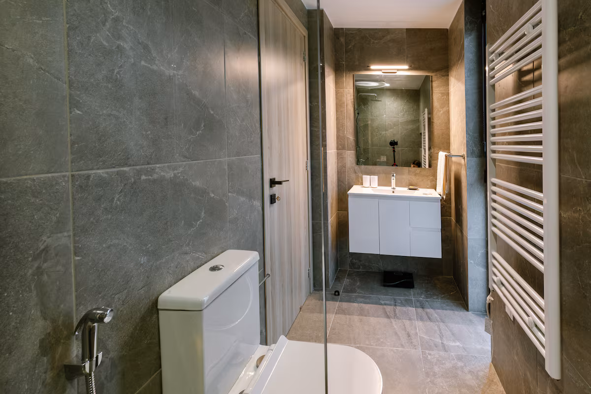 Bathroom with a heated towel rail, shower and vanity