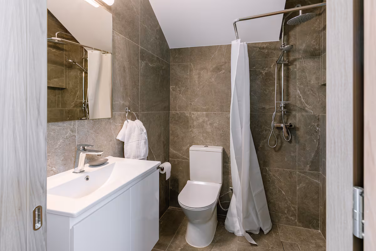 Bathroom with a shower, vanity and toilet